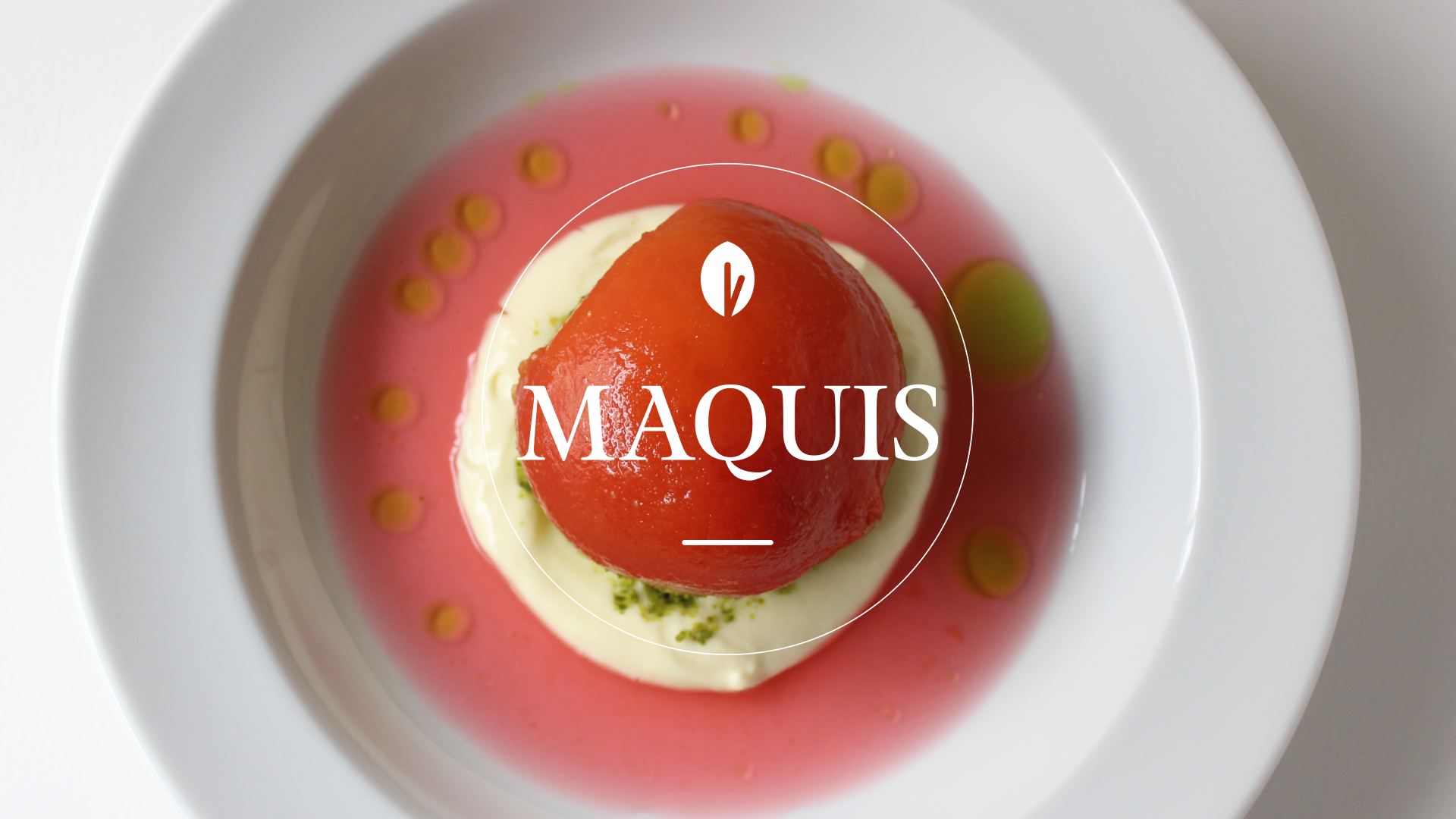 A tomato dish with sauce in a white bowl, labeled 'MAQUIS'.