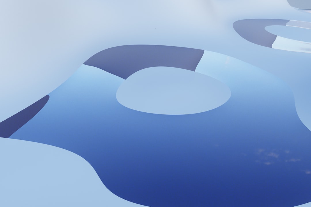 Abstract blue and white shapes with smooth curves.