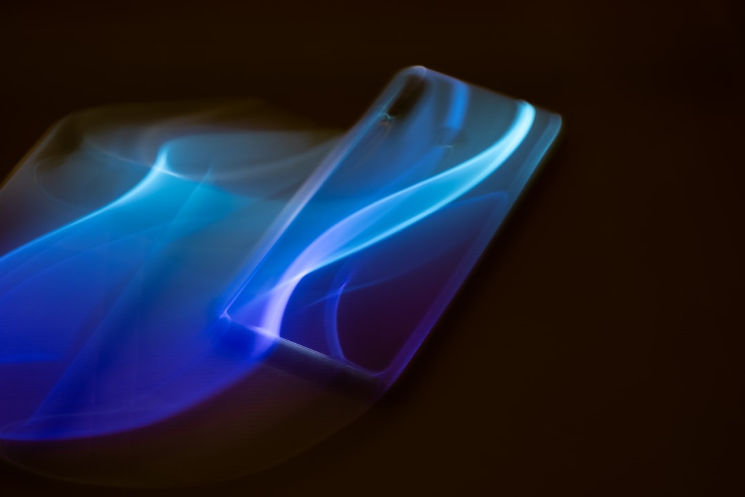 Abstract image of a smartphone with blue light trails.