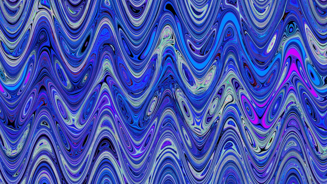 Abstract wavy pattern in blue and purple tones.