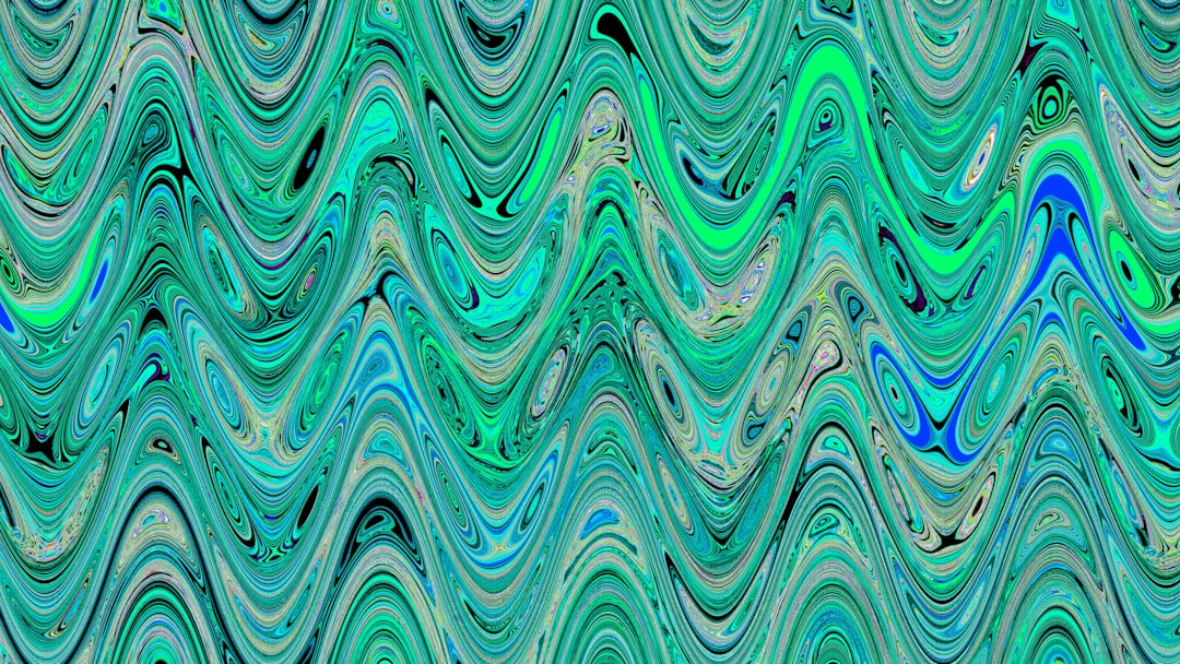 Abstract wavy pattern in green and blue tones.