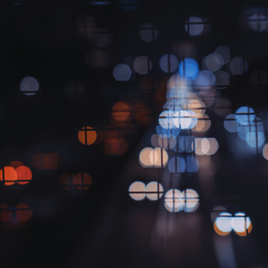 Blurred city lights at night with bokeh effect.