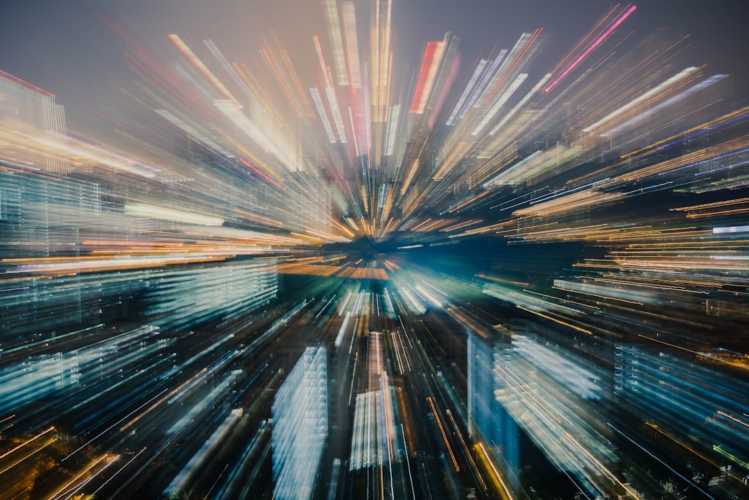 Cityscape with light trails creating a zoom effect.