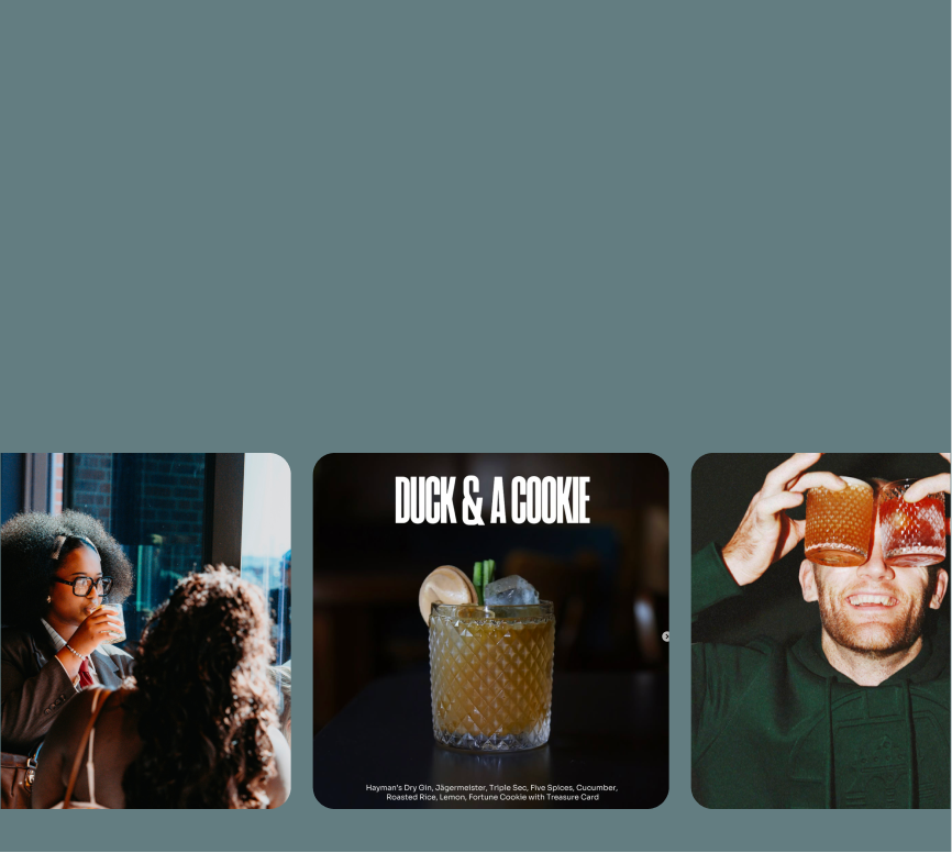 Collage of three images. Left: Two people sitting at a table by a window, one is drinking. Center: A cocktail in a textured glass with text 'DUCK & A COOKIE' and ingredients listed below. Right: A person holding two drinks up to their face, smiling.