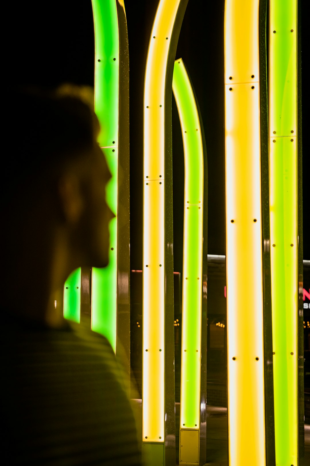 Colorful illuminated light installations at night.