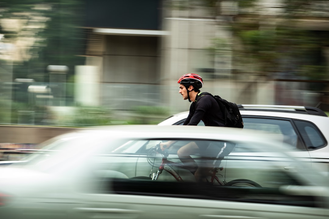 Cyclist riding through city traffic.