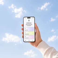 A hand holds a smartphone against a blue sky with white clouds. On the screen it says 'Hi! Welcome to Pola Workspace. What would you like to do today?' with options 'About Pola', 'Project insights', 'Create a brief'.