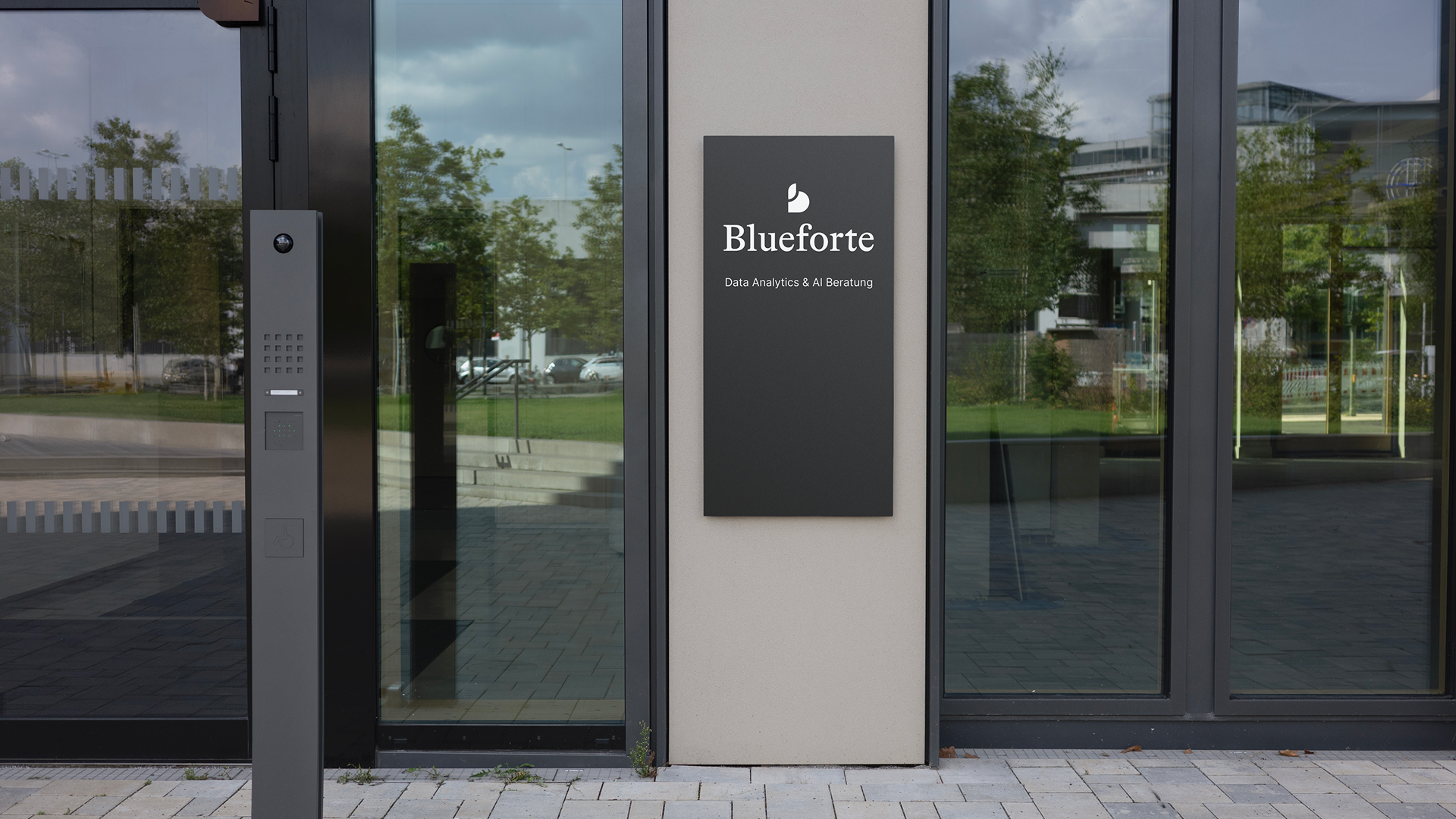 Entrance of a building with a sign reading 'Blueforte'.