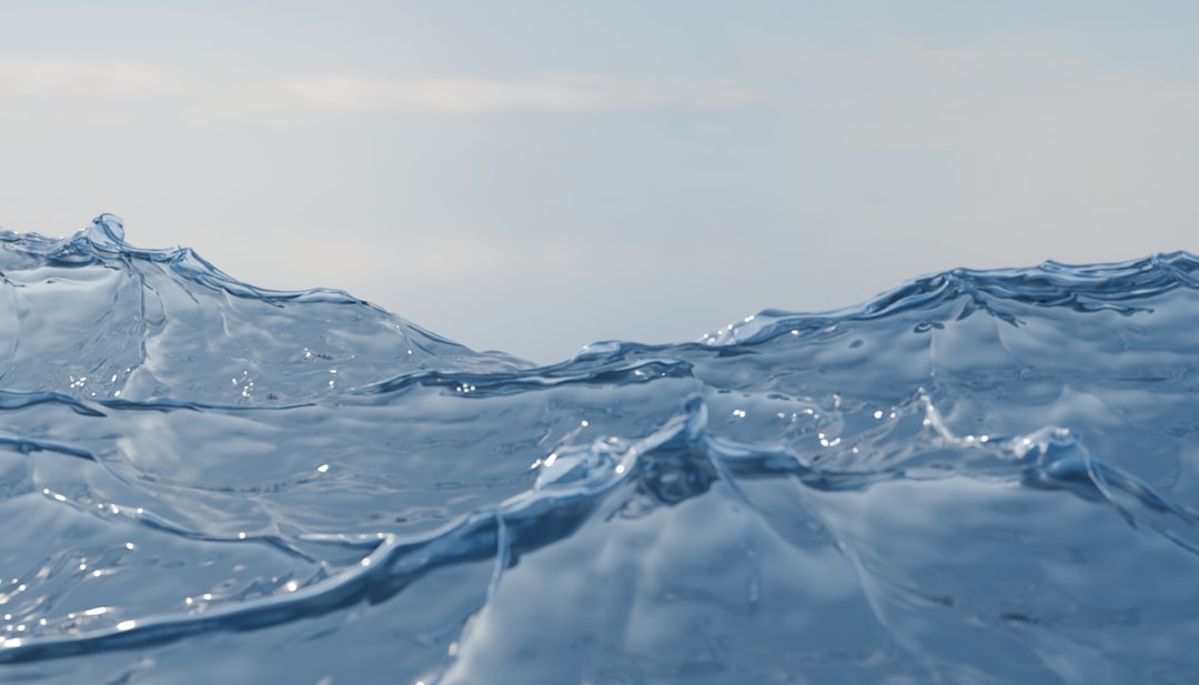 Gentle ocean waves under a clear sky.