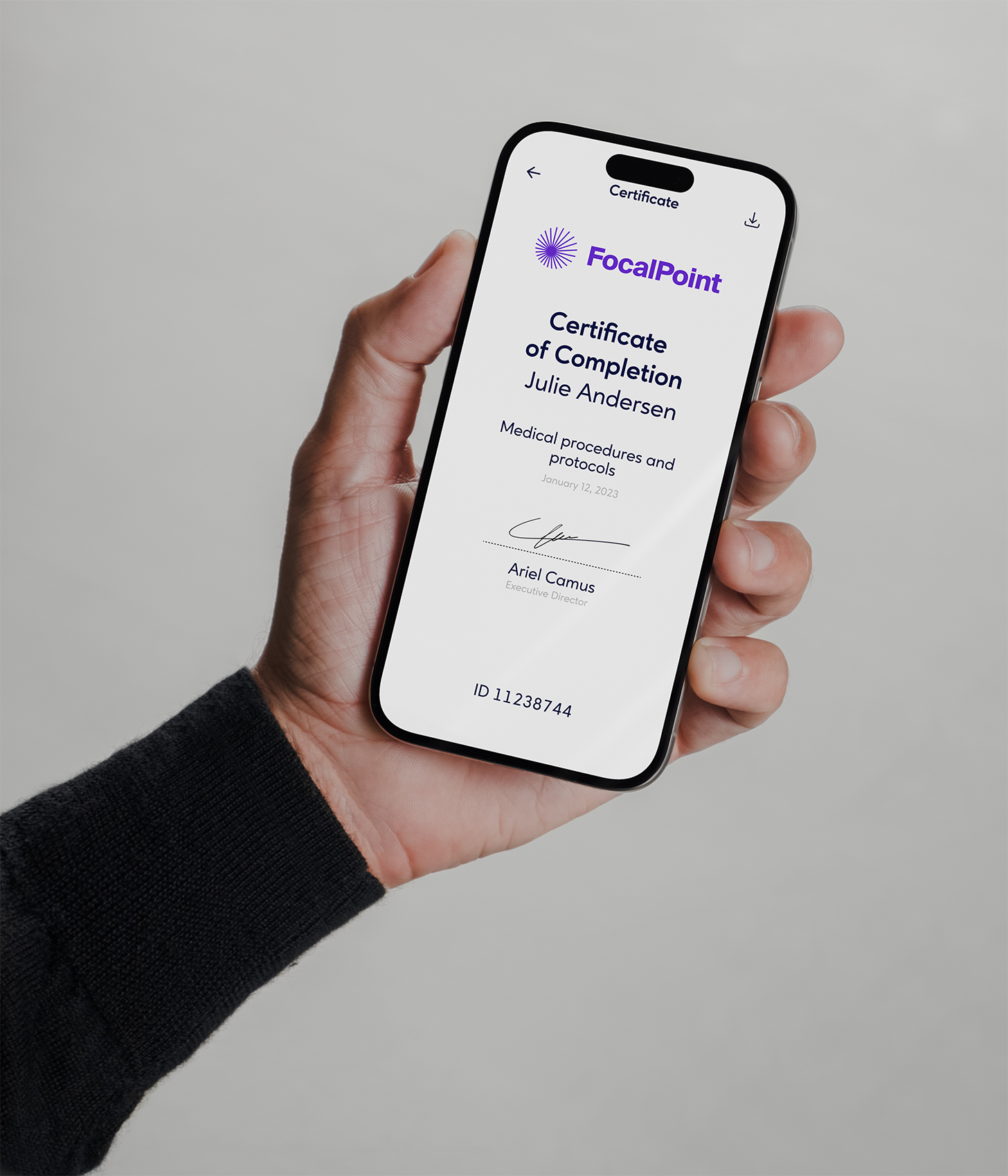 Hand holding a smartphone displaying a digital certificate.