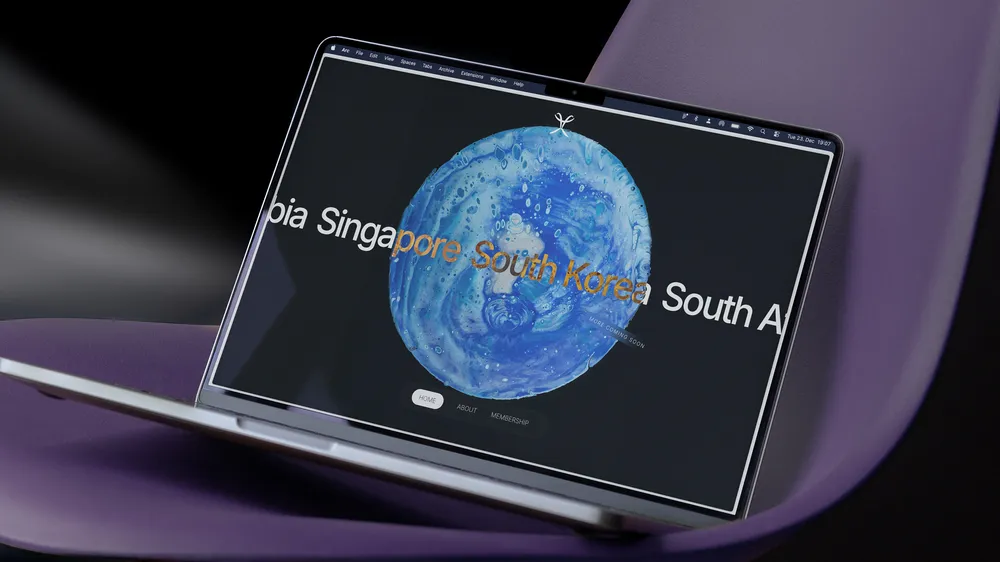 Laptop displaying a digital globe with country names.