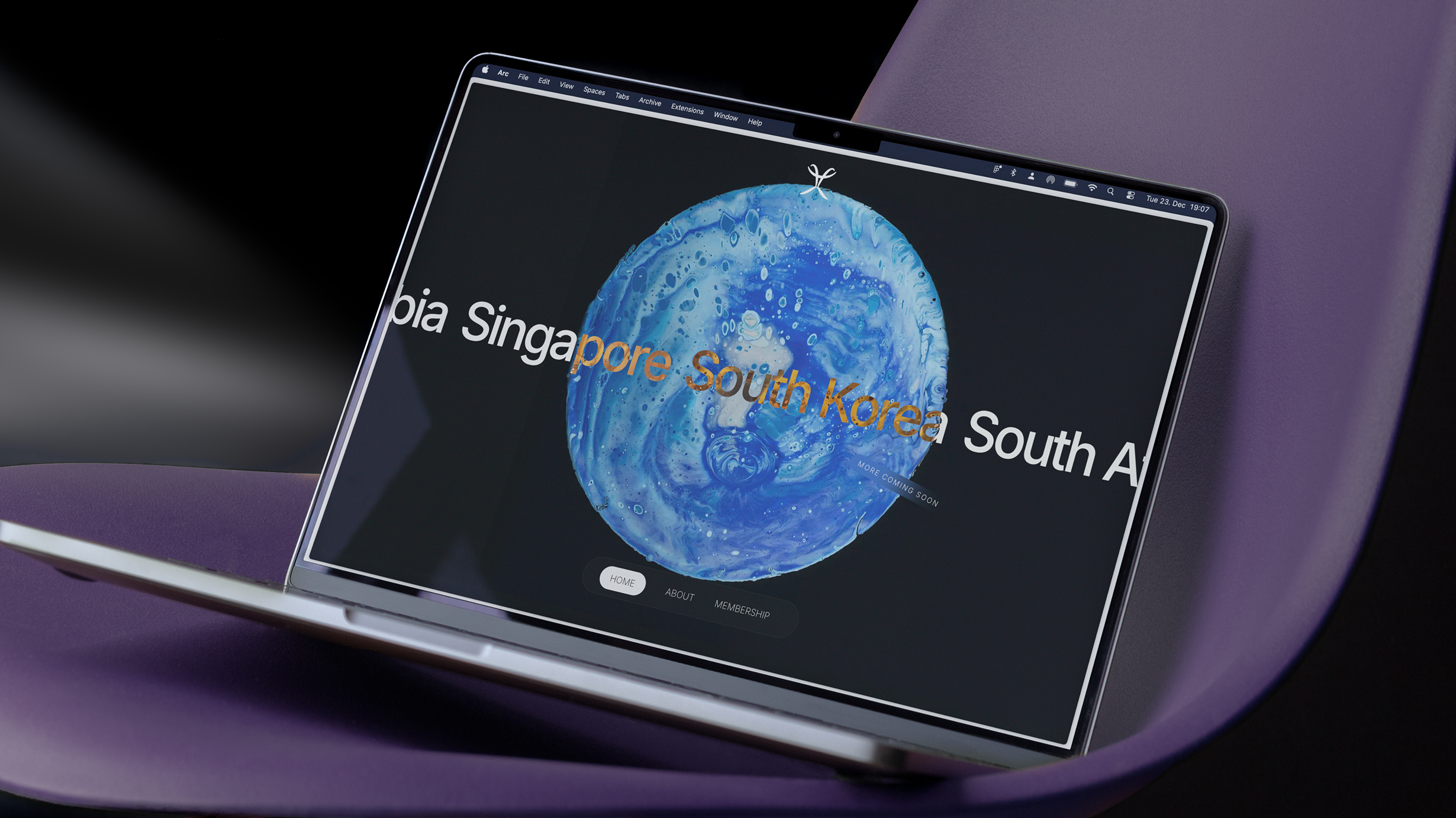 Laptop displaying a digital globe with country names.