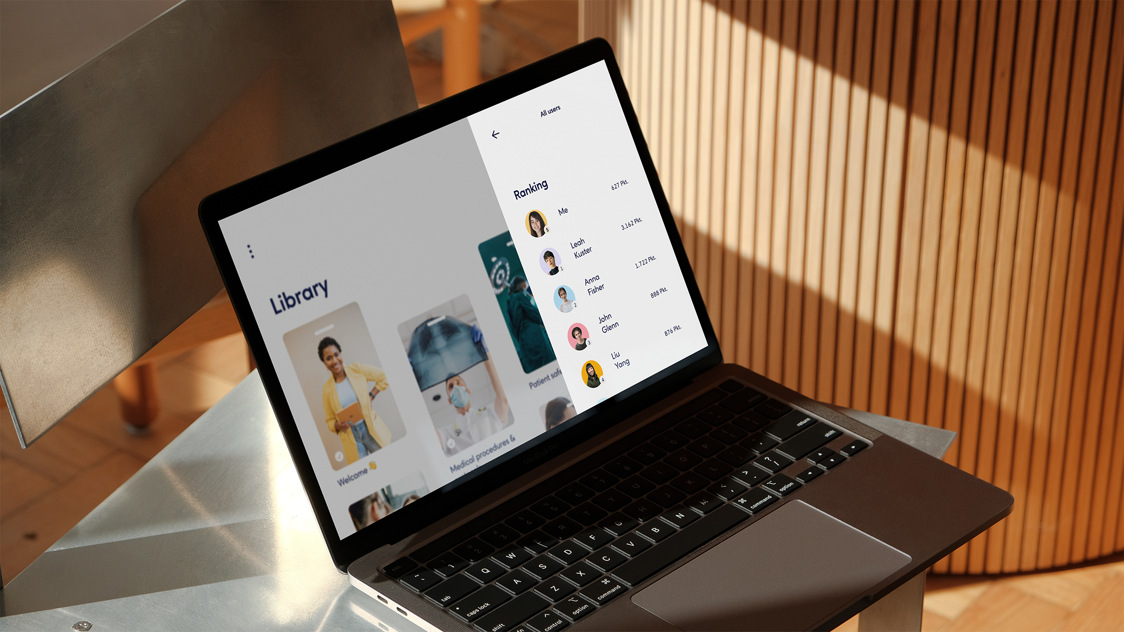 Laptop displaying a digital library interface on a table.
