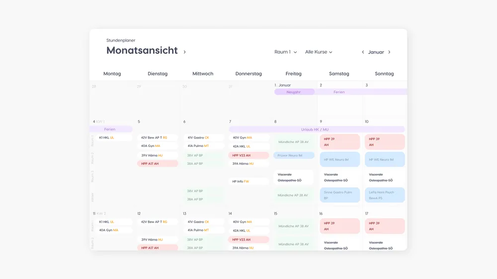 Monthly planner calendar with various colored entries.