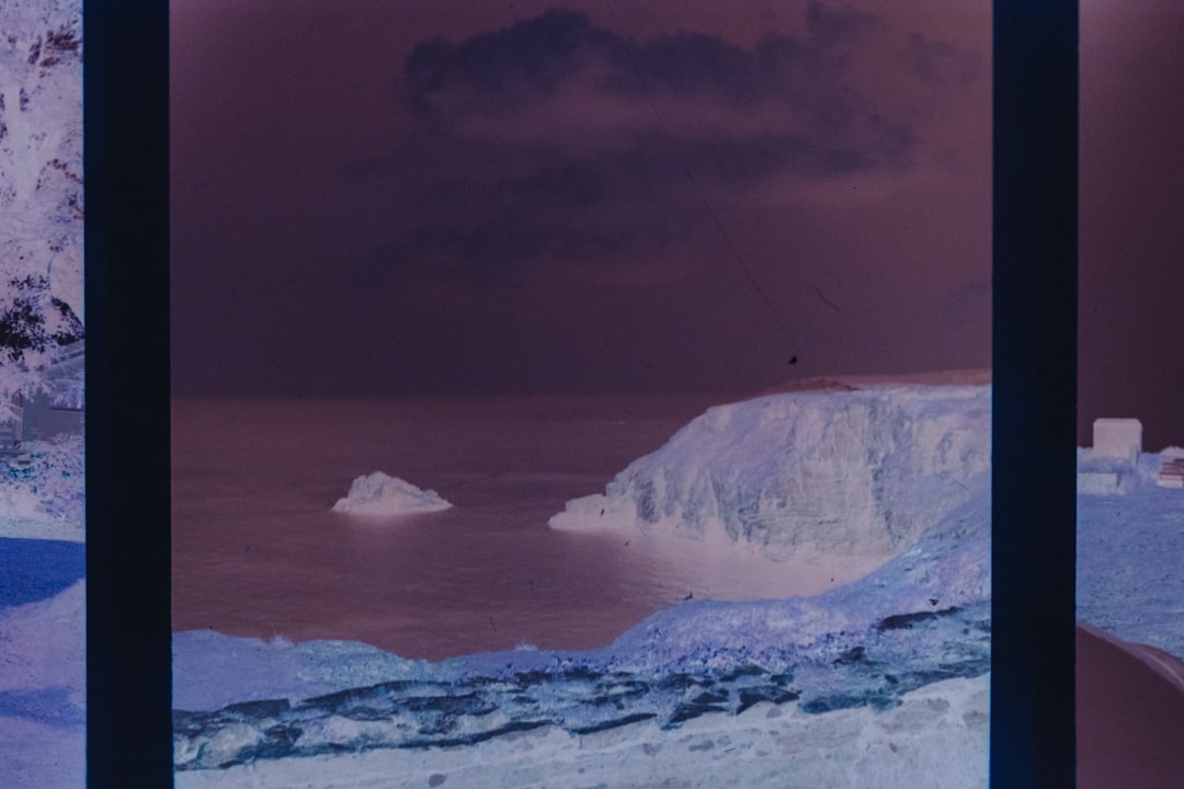 Negative image of a coastal cliff and sea.