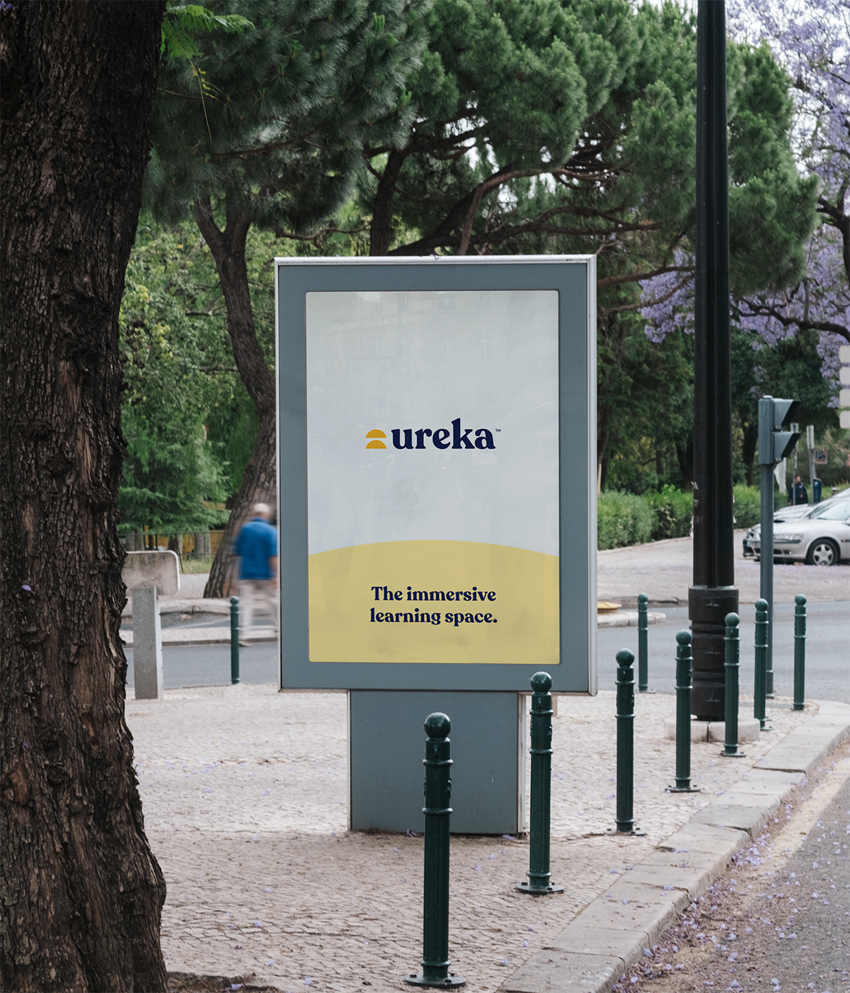 Outdoor advertisement for Ureka in a park setting.