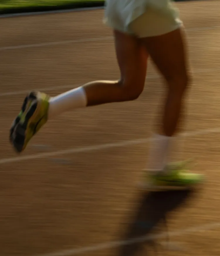 Person running on a track.