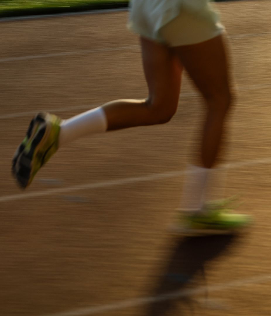 Person running on a track.