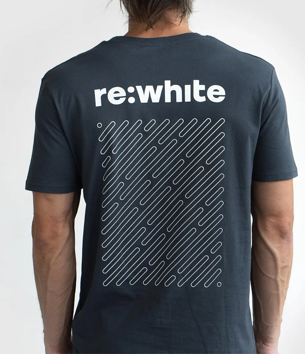 Person wearing a black t-shirt with 're:white' text and geometric design on the back.