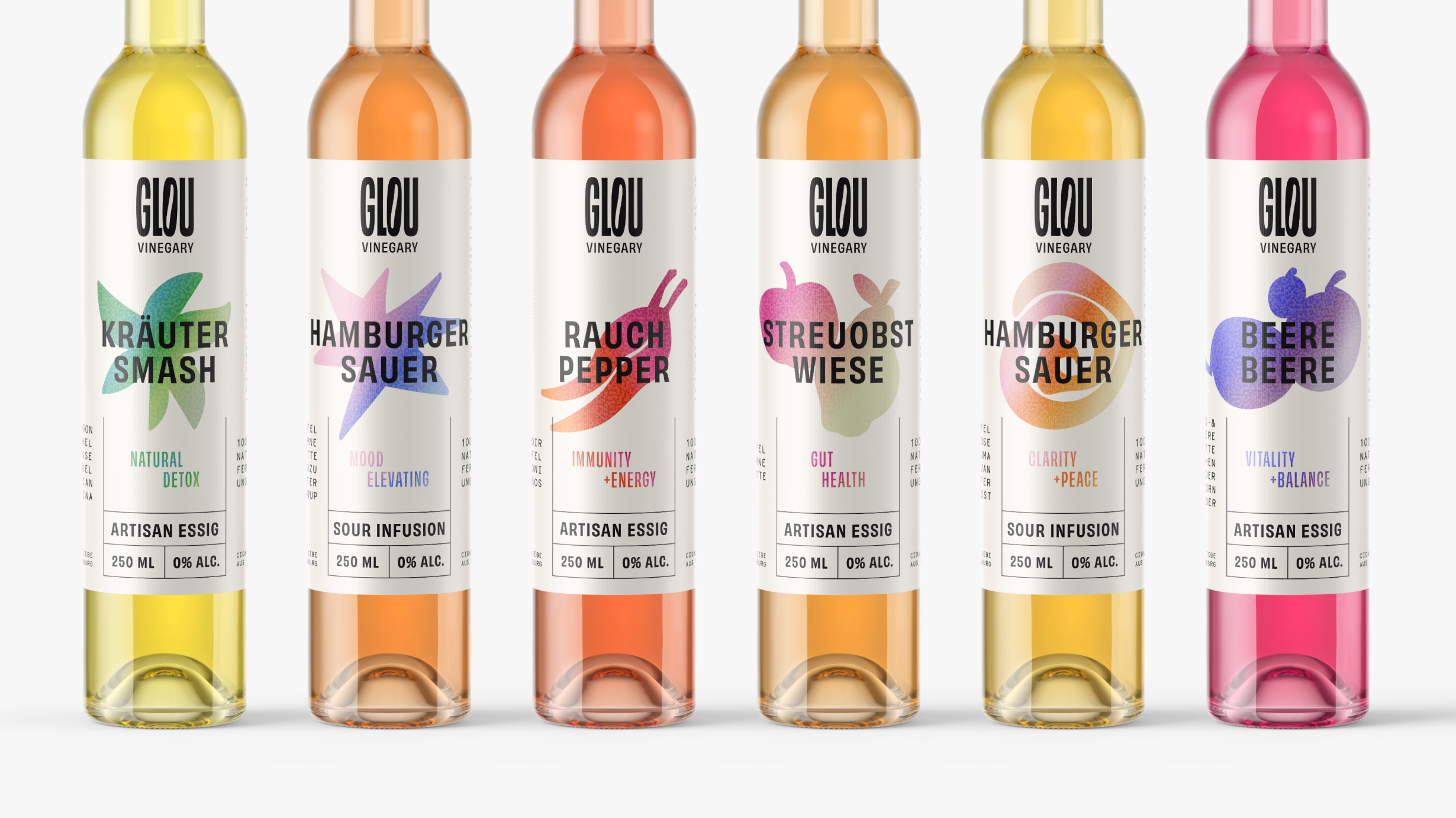 Six bottles of Glou Vinegary artisan essig with colorful labels.