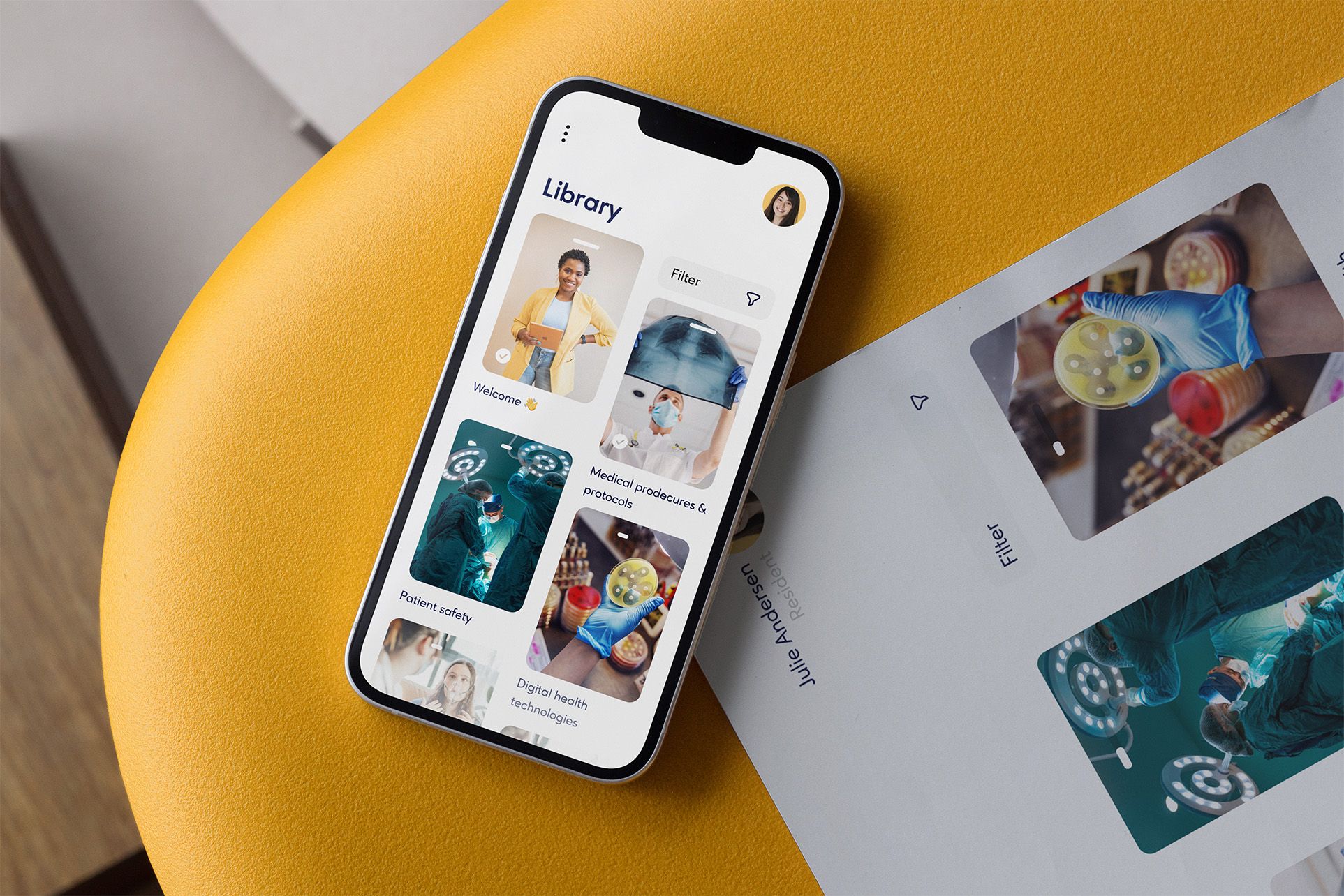 Smartphone displaying a medical app interface on a yellow surface.