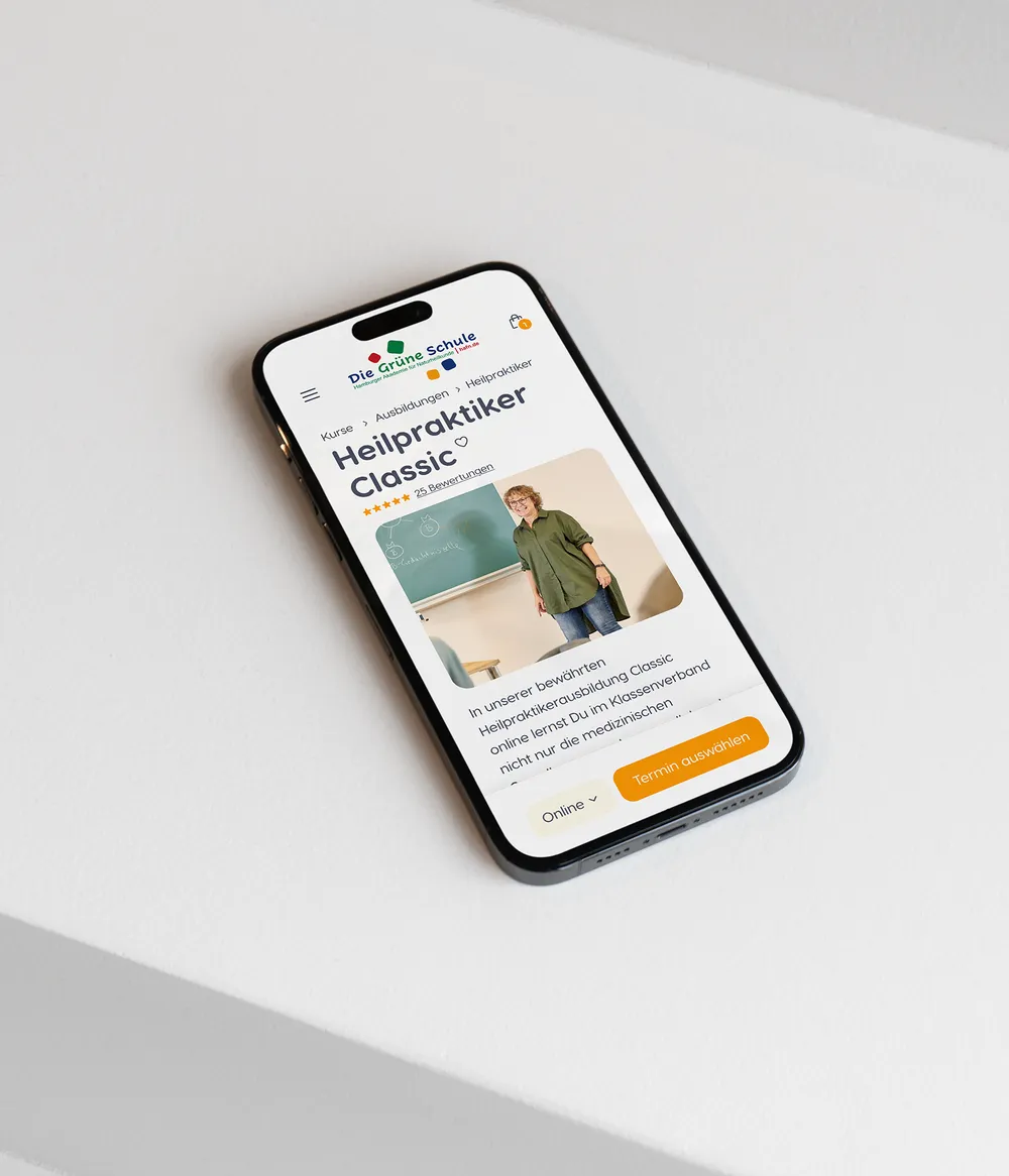 Smartphone displaying a website on a white surface.
