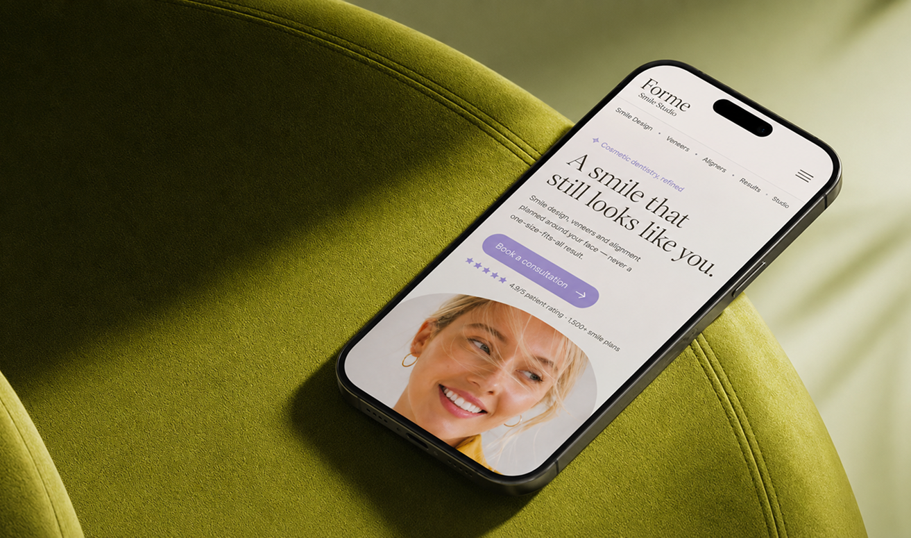 Smartphone displaying a website with the text 'A smile that still looks like you' on a green chair.
