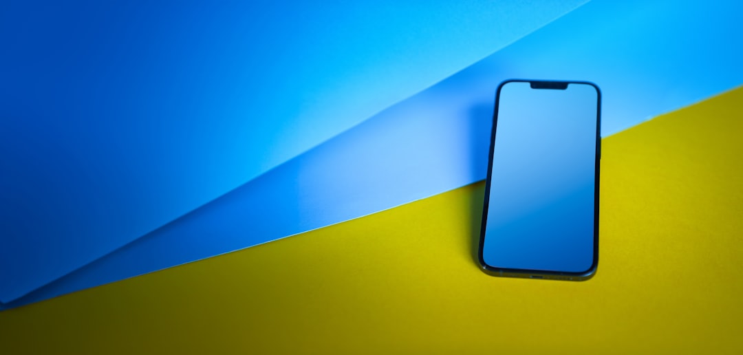 Smartphone on a blue and yellow background.